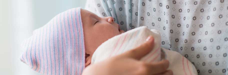 Mother holding newborn baby