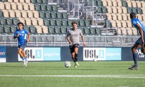 soccer player kicking ball