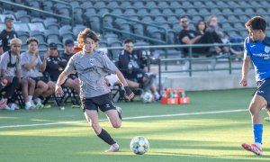 soccer player kicking ball