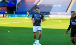 soccer player kicking ball
