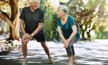 Older man and woman stretching