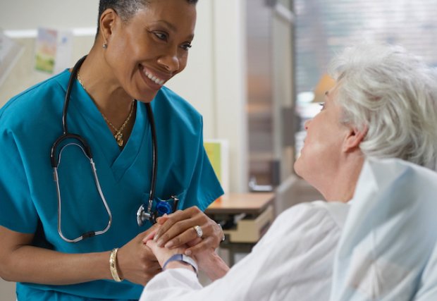 A nurse comforting a patient