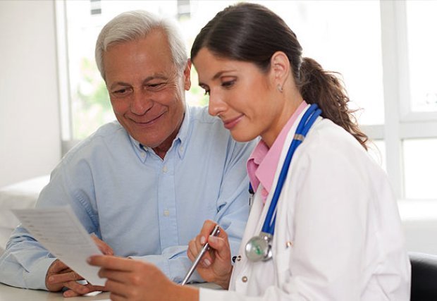 Female doctor and senior man