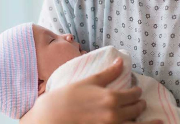 Mother holding newborn baby