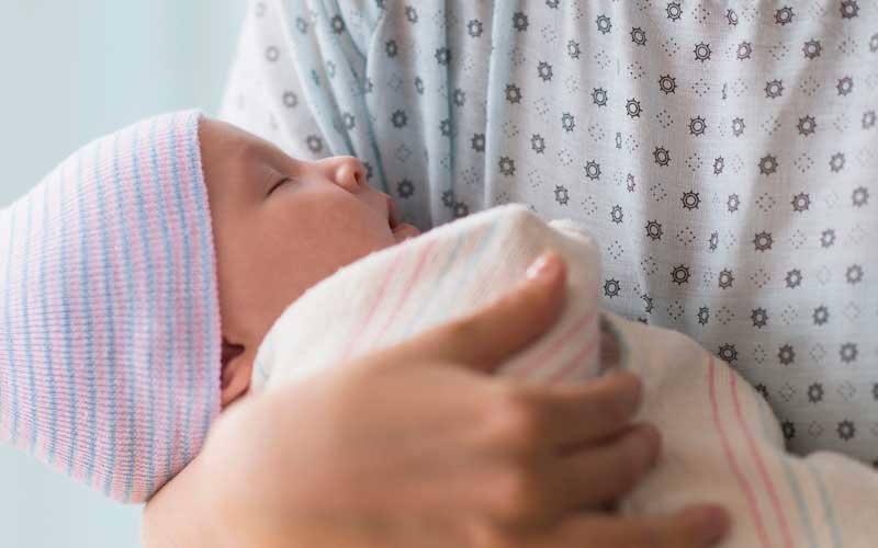 Mother holding newborn baby