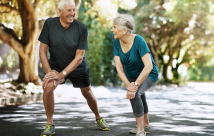 Older man and woman stretching