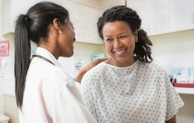 female doctor and female patient smiling