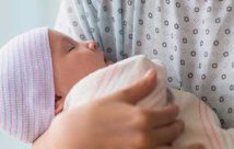 Mother holding newborn baby